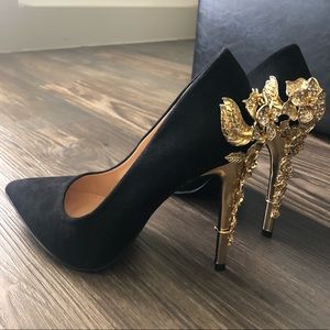 Black heels with gold flower accents